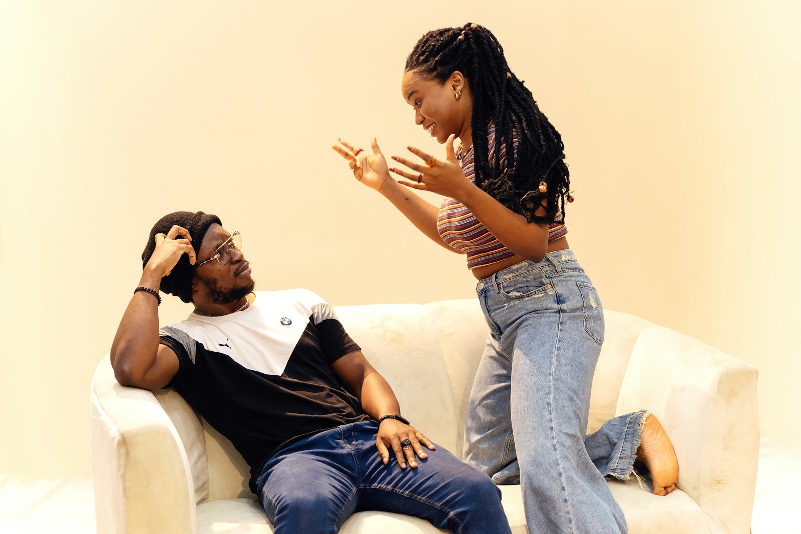 A man sitting on a couch next to a woman