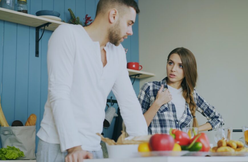 Couple arguing in a kitchen