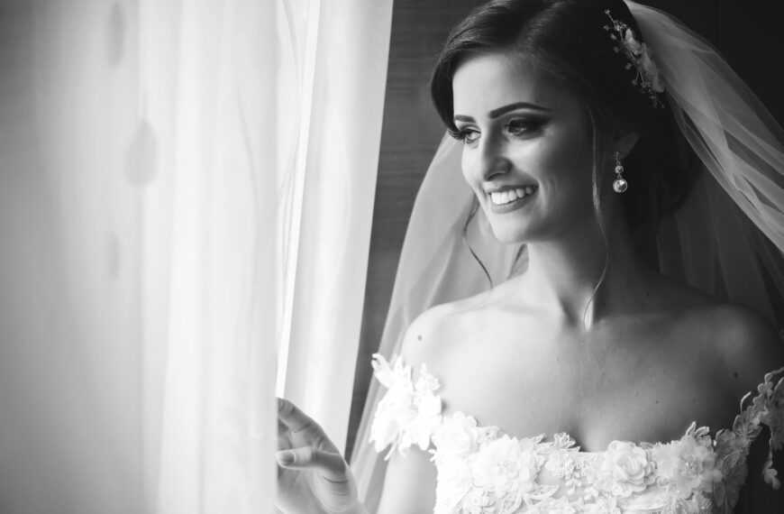 grayscale photo of woman in wedding gown