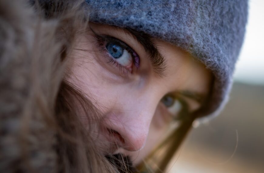 a close up of a person wearing a hat