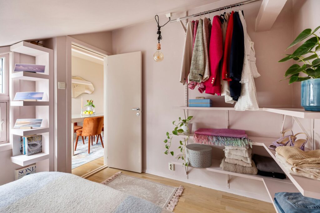 A bedroom with a bed and a closet