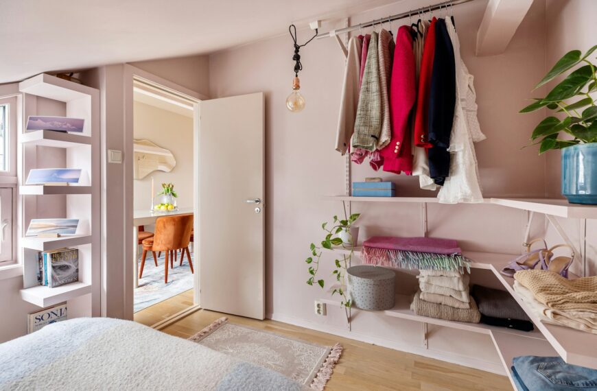 A bedroom with a bed and a closet