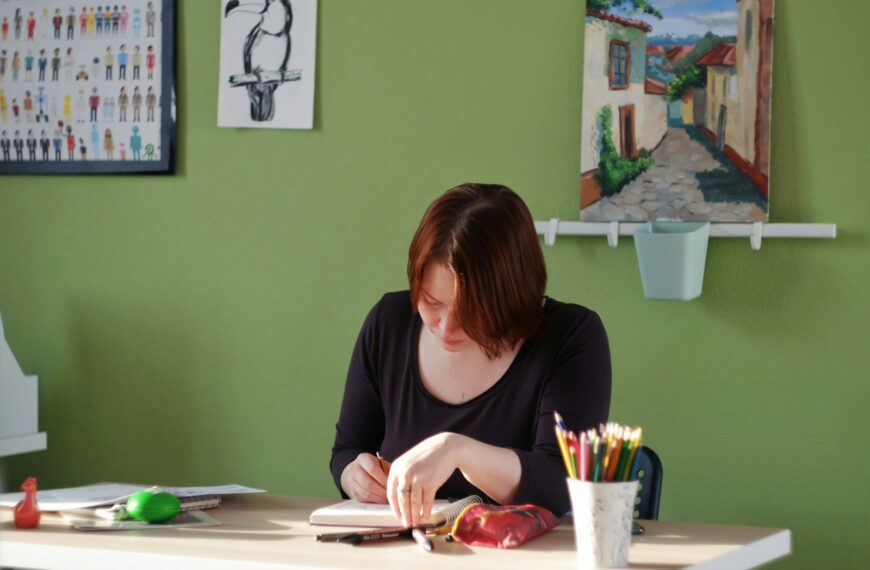 woman in black long sleeve shirt sitting at the table