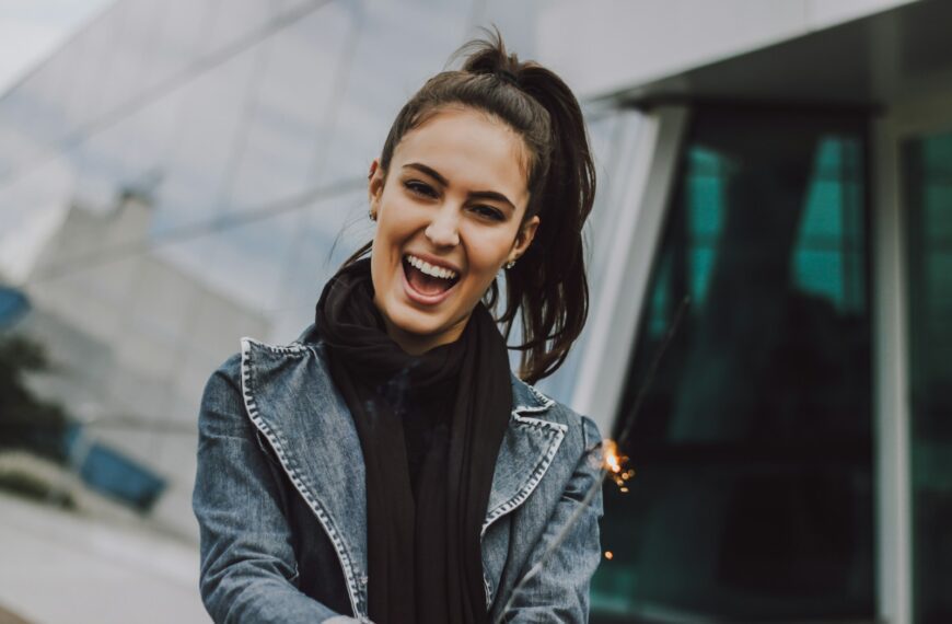 woman wearing gray denim jacket and black scarf