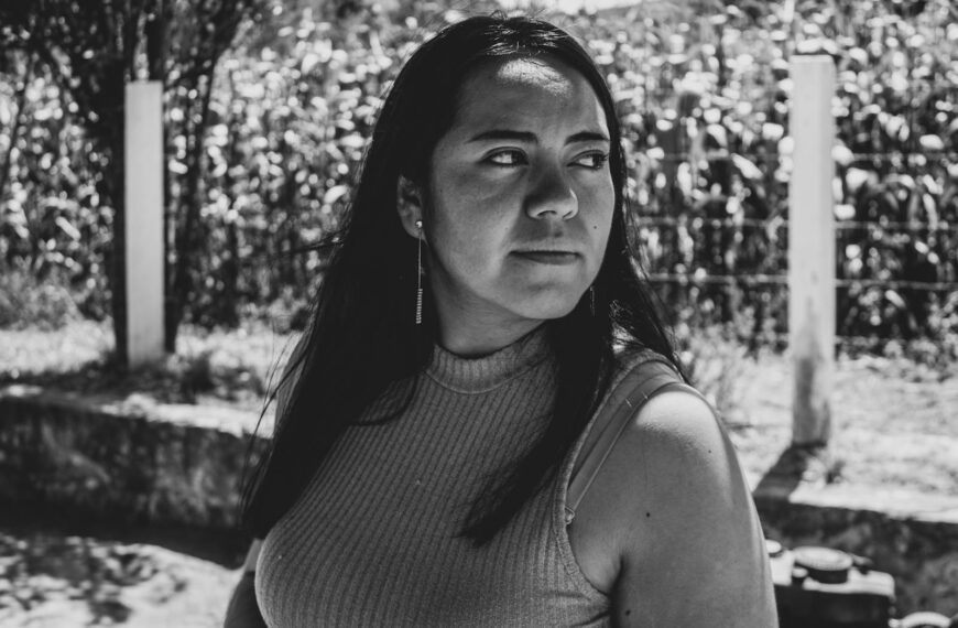 Emotive black and white portrait of a woman outdoors in a Mexican farm field.