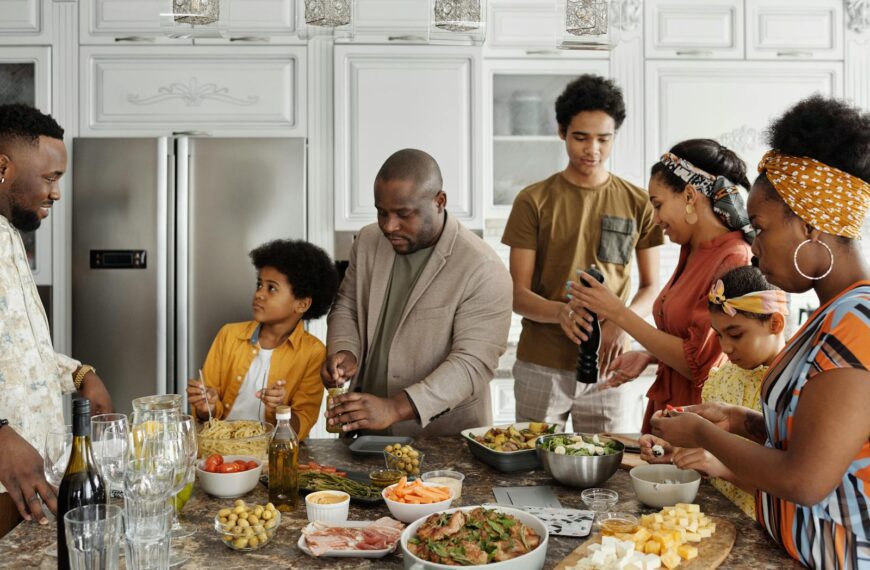 Family preparing a meal together in a lively kitchen setting, capturing joy and togetherness.