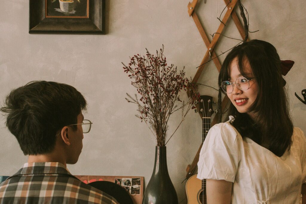 a man and a woman sitting next to each other