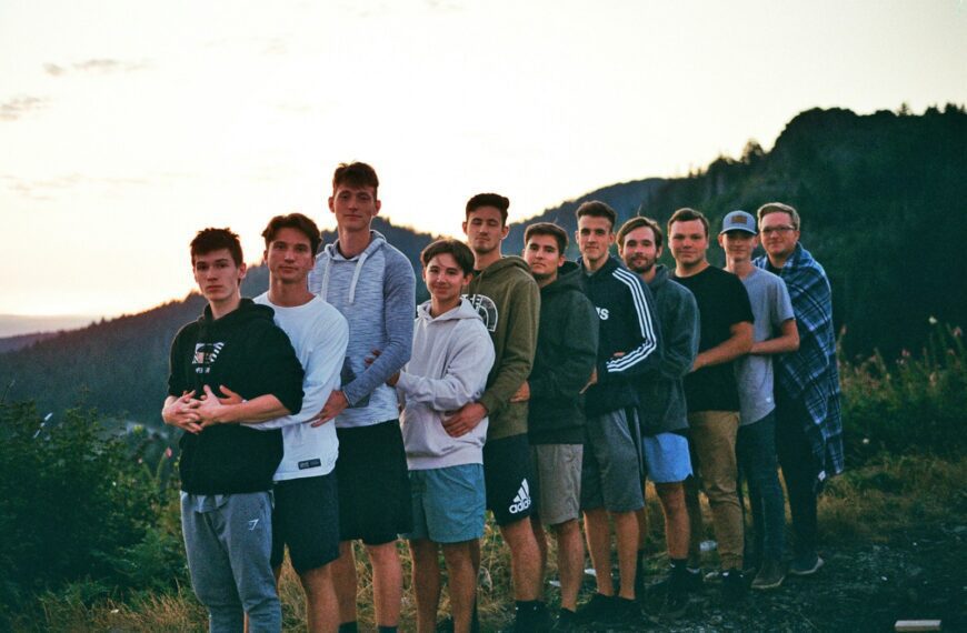 a group of young men standing next to each other