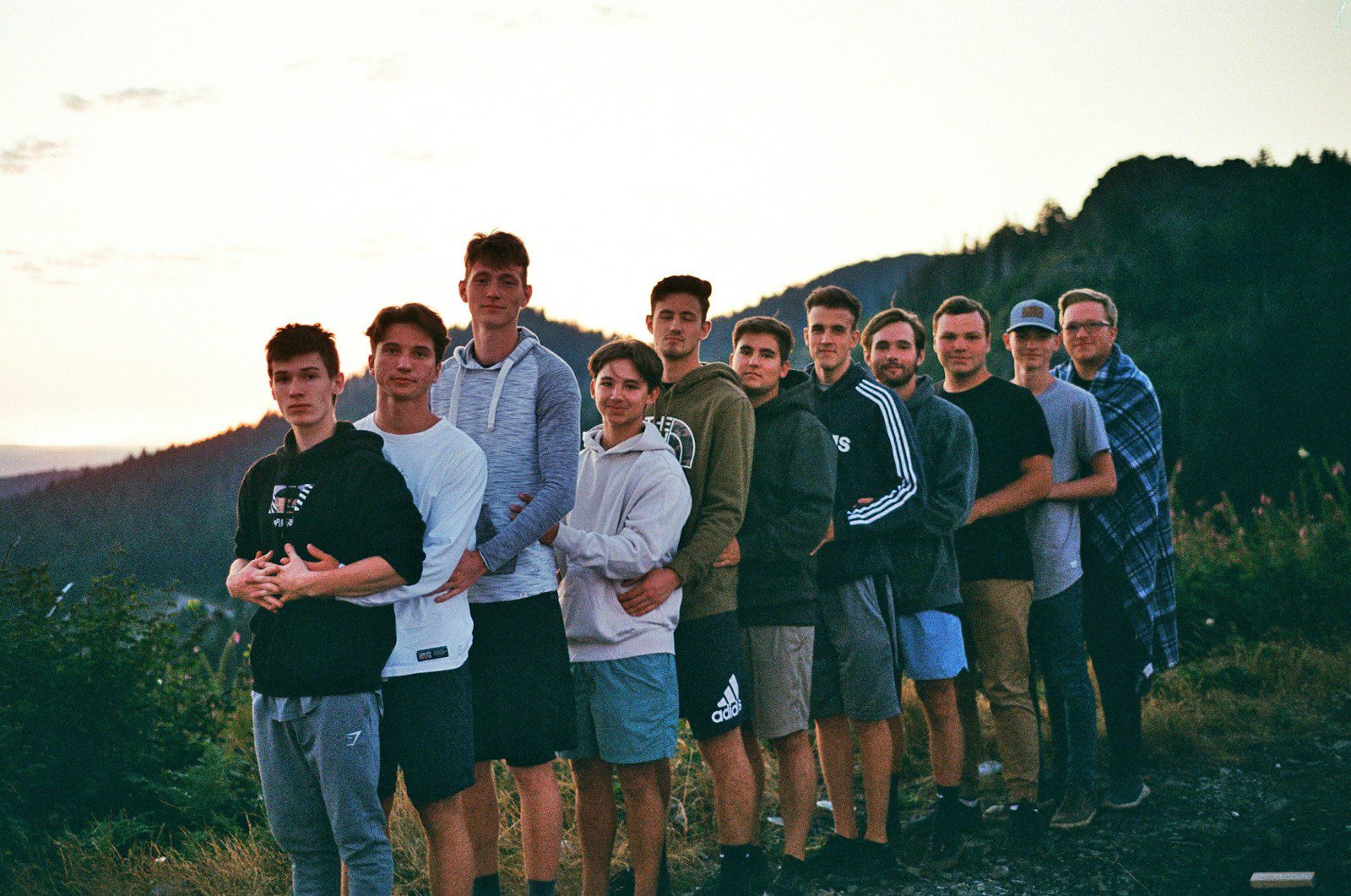 a group of young men standing next to each other