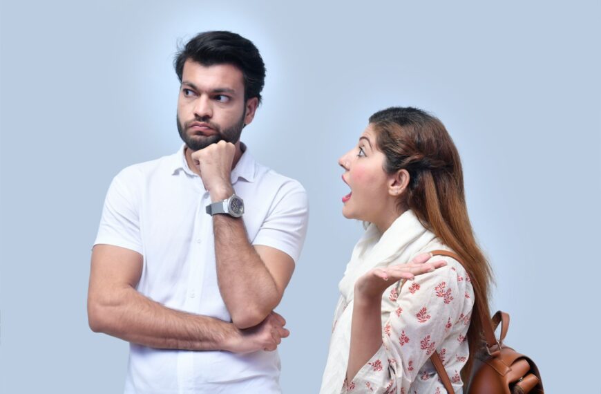 a man and woman looking at each other