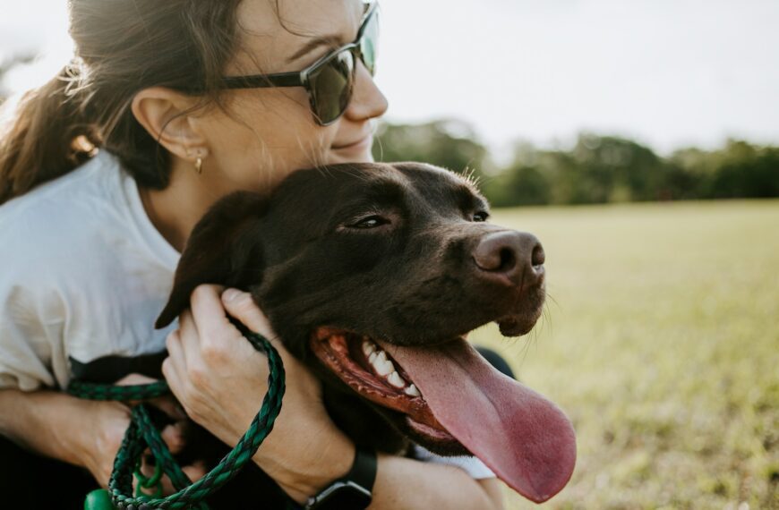 woman hugging a dog