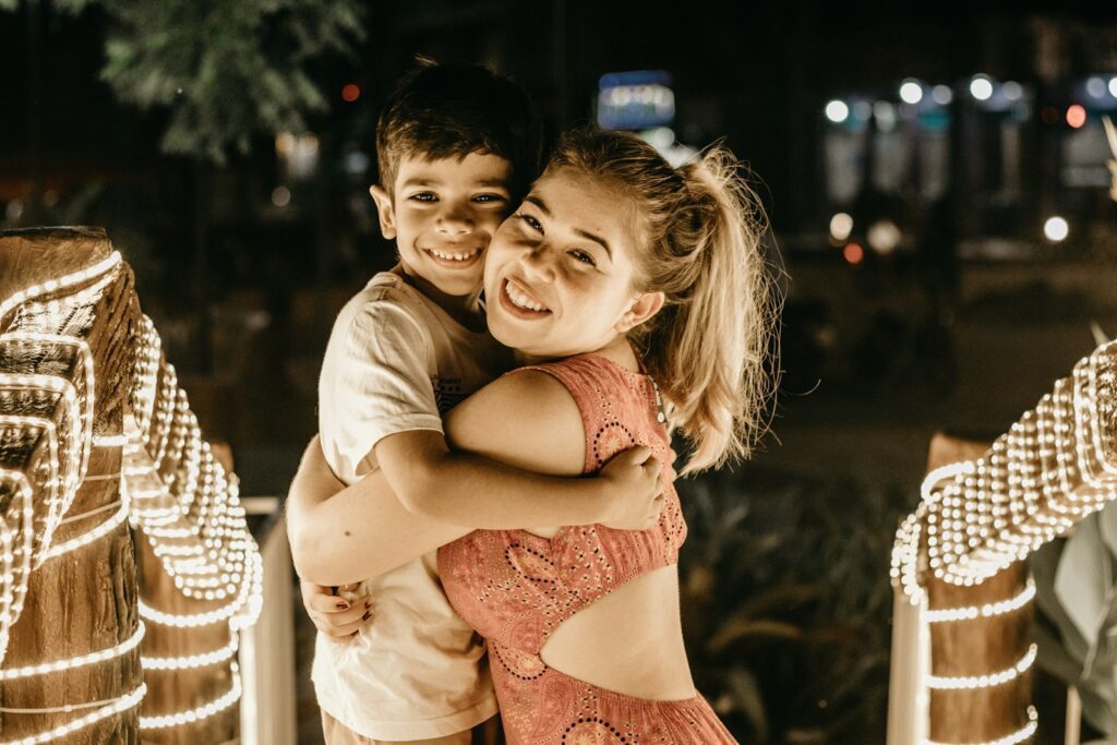 a boy and a girl hugging each other