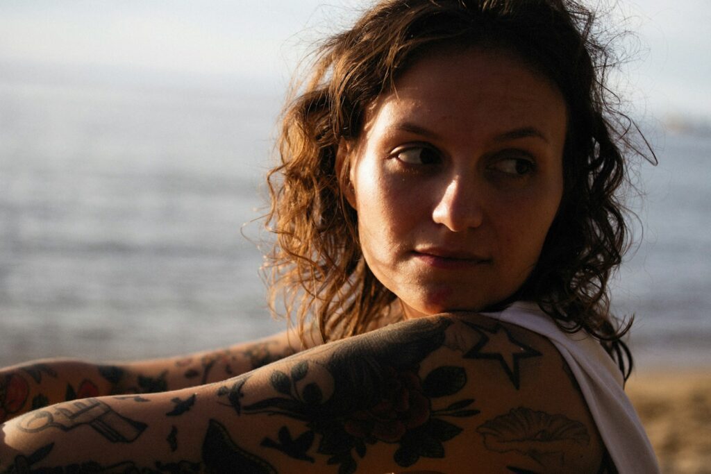 a woman with a tattoo on her arm
