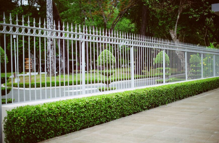 white wooden fence near green grass field