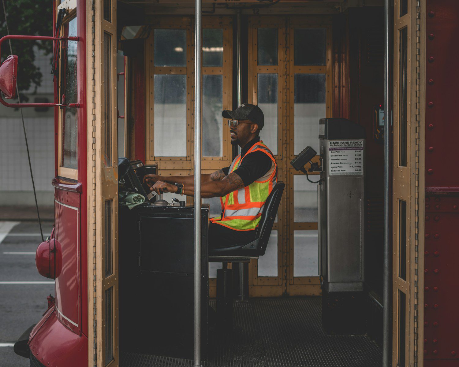man sitting on chair controlling bus