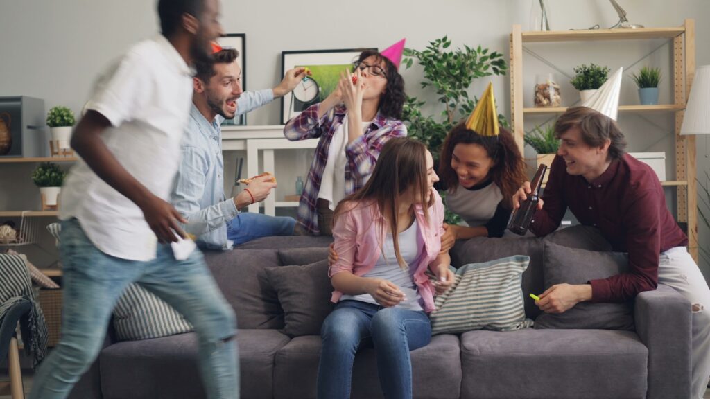 a group of people sitting on top of a couch