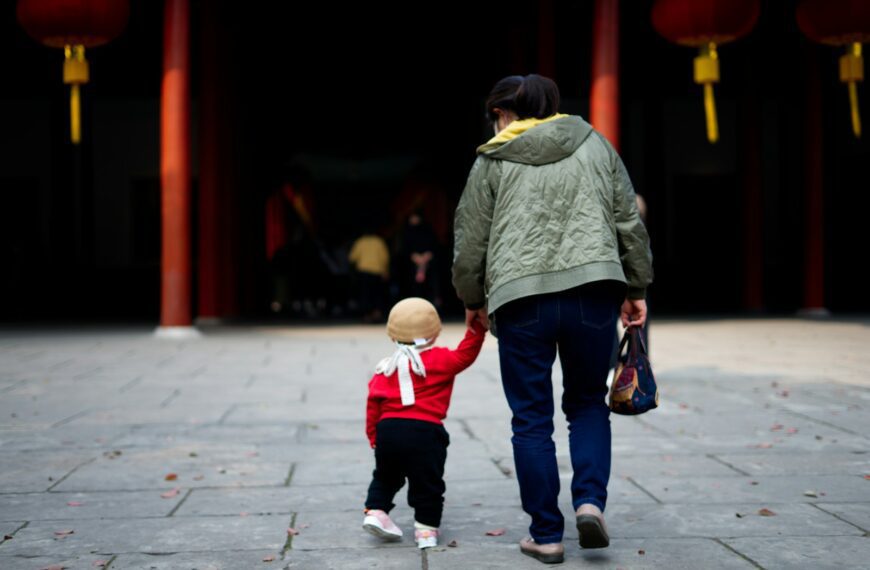 a person and a child walking
