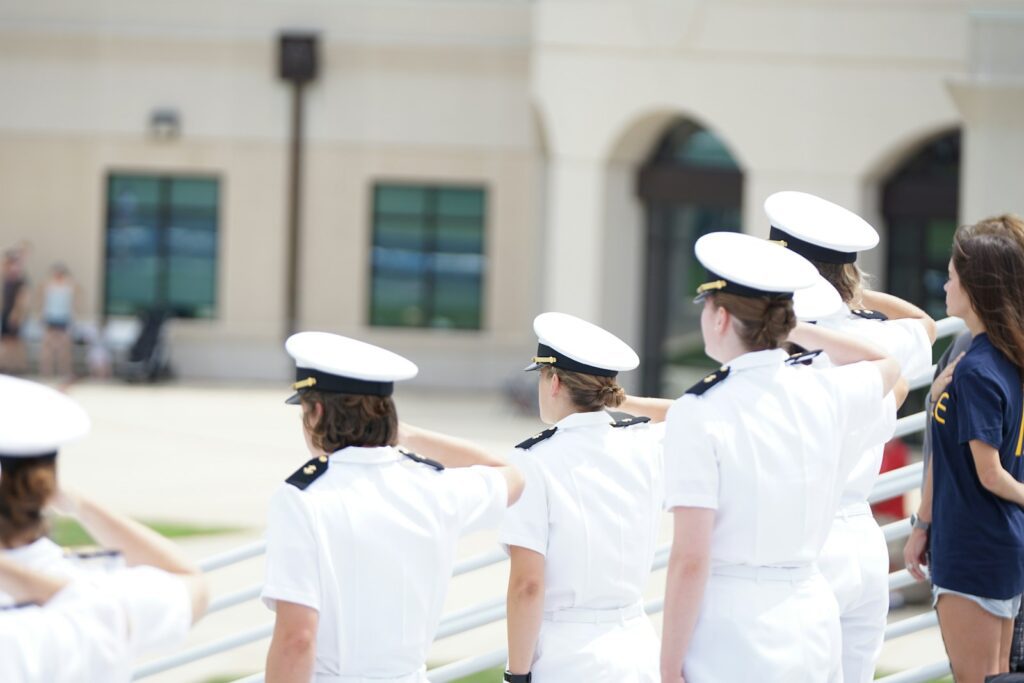 five person wearing white suits
