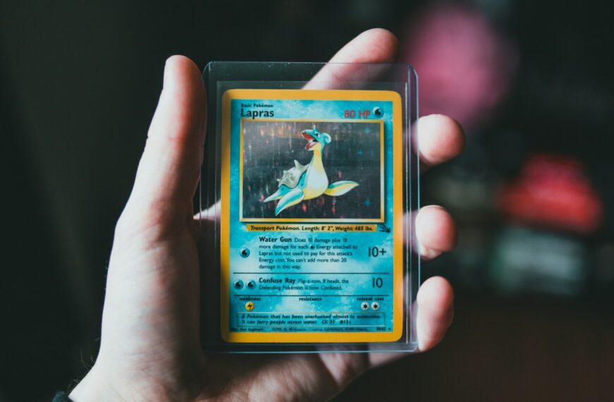 pokemon trading card on persons hand