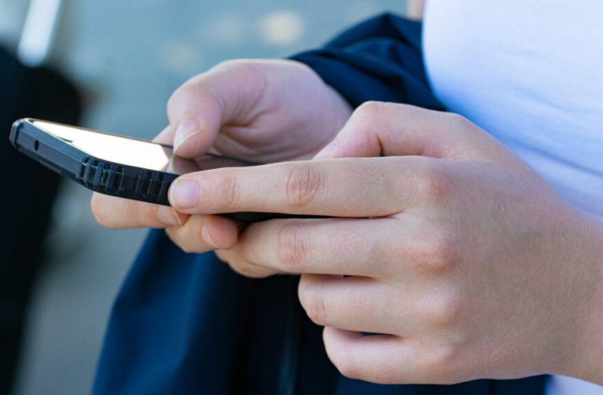 a close-up of hands holding a phone