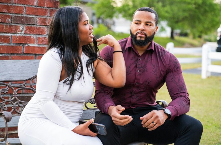 a man and a woman sitting on a bench
