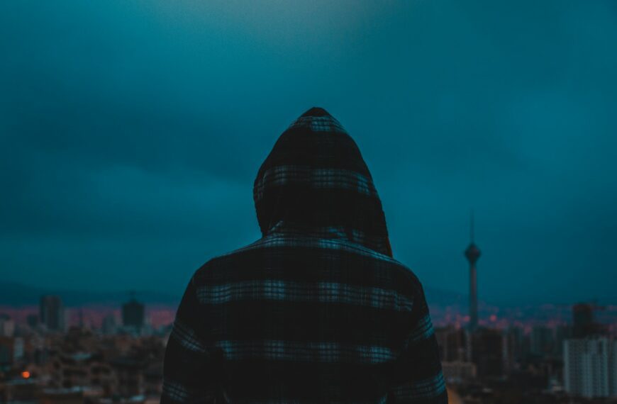 person in black and red plaid hoodie
