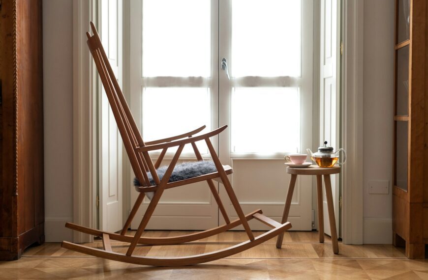brown wooden chair near window