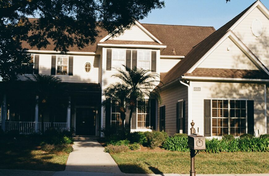 A large, two-story house with a covered porch.