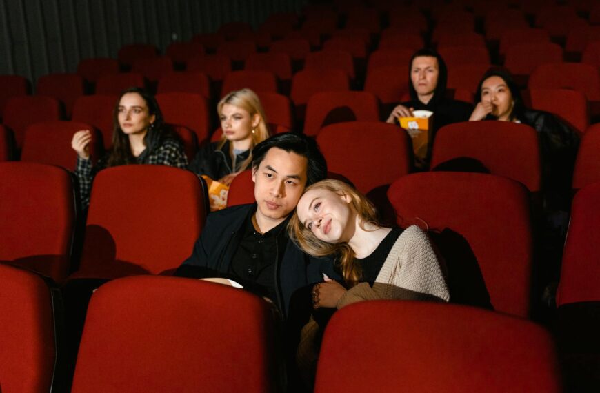 Multiple couples enjoying a movie in a cozy cinema setting, perfect for entertainment themes.