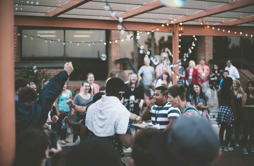 a group of people standing around each other