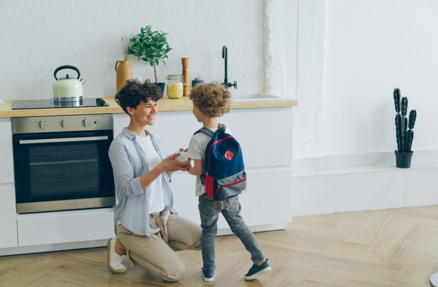 a woman and a child in a kitchen