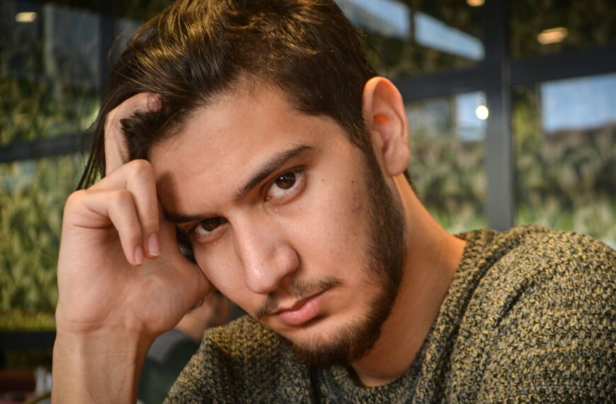man in grey and black sweater
