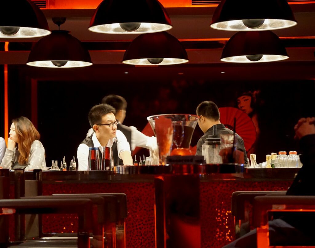 people standing in front of table