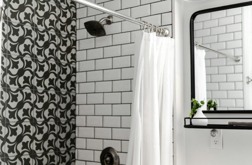 white shower curtain on stainless steel shower head