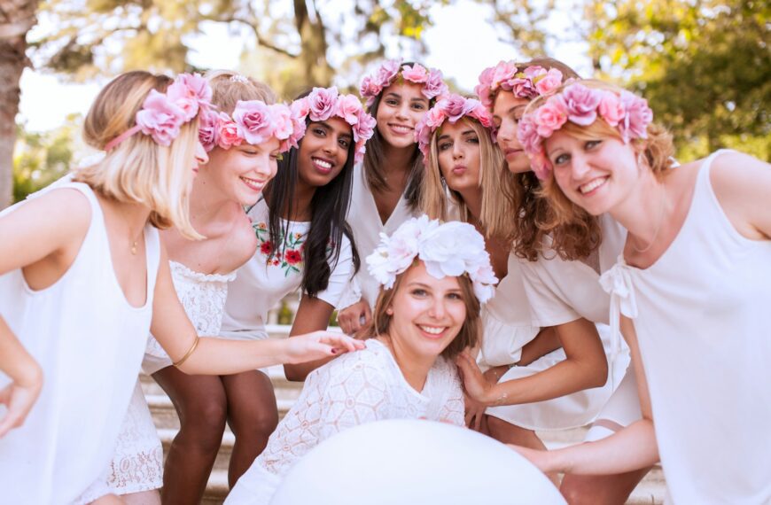 photo shoot of bride and her bridesmaid wearing floral tiaras