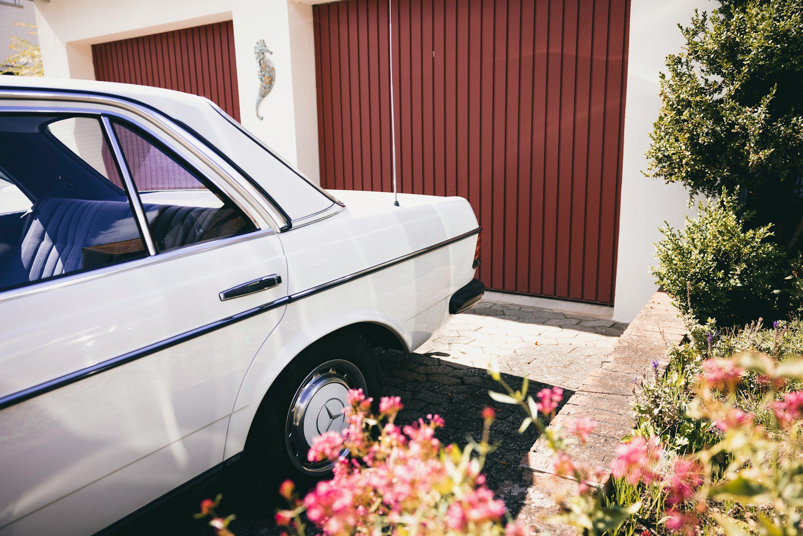 a car parked in front of a garage