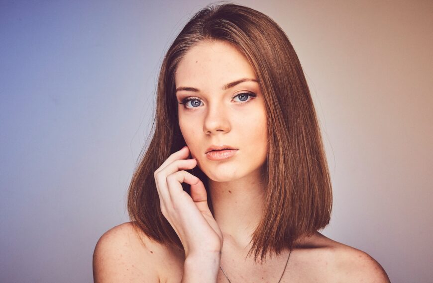 woman with her hand on cheek