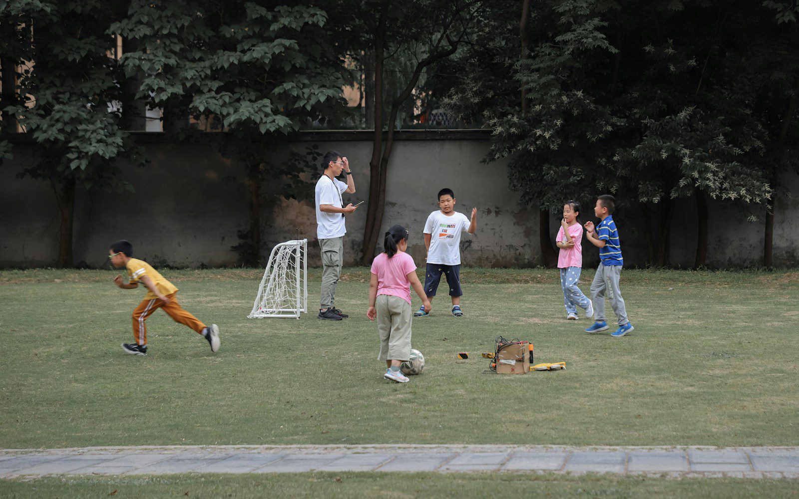 people standing on green grass field during daytime