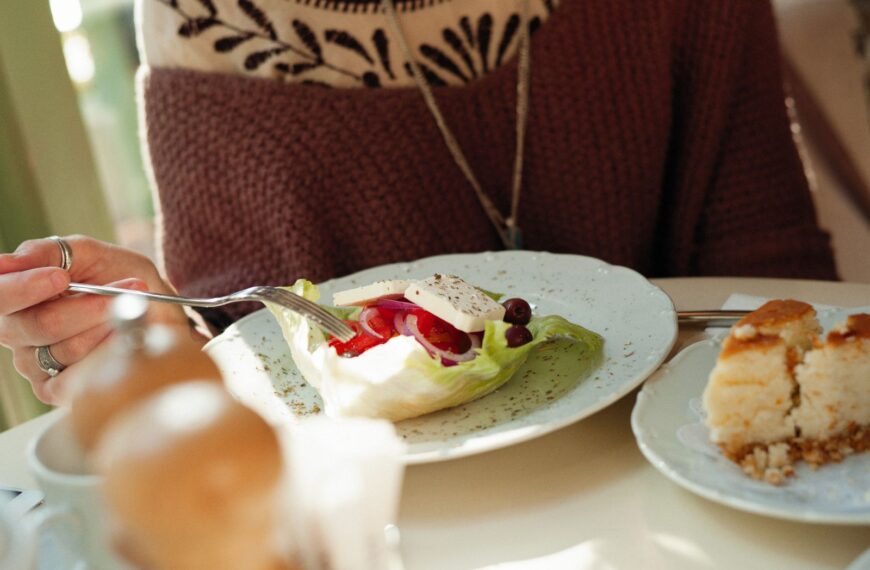 A cozy cafe scene with a fresh salad and dessert. Perfect for culinary themes.