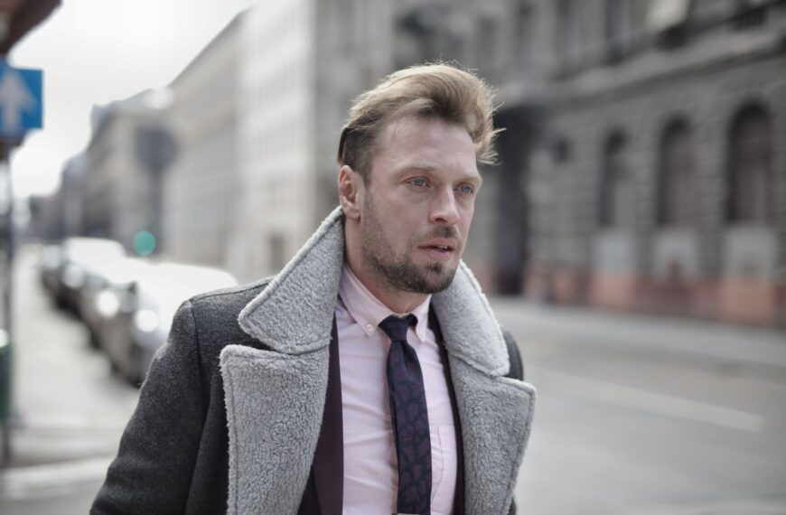 Portrait of a fashionable man in urban street setting on an overcast day.