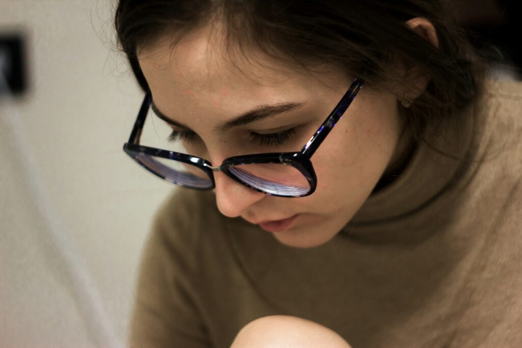 woman in black framed eyeglasses