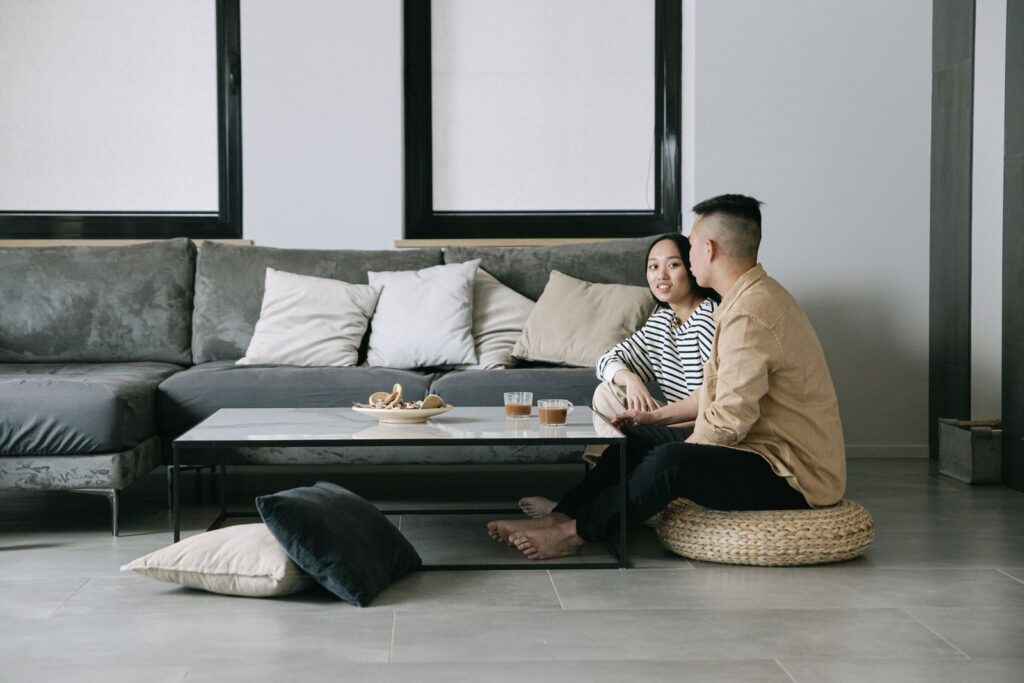 A couple enjoying a serene moment in a stylish Scandinavian-inspired living room.