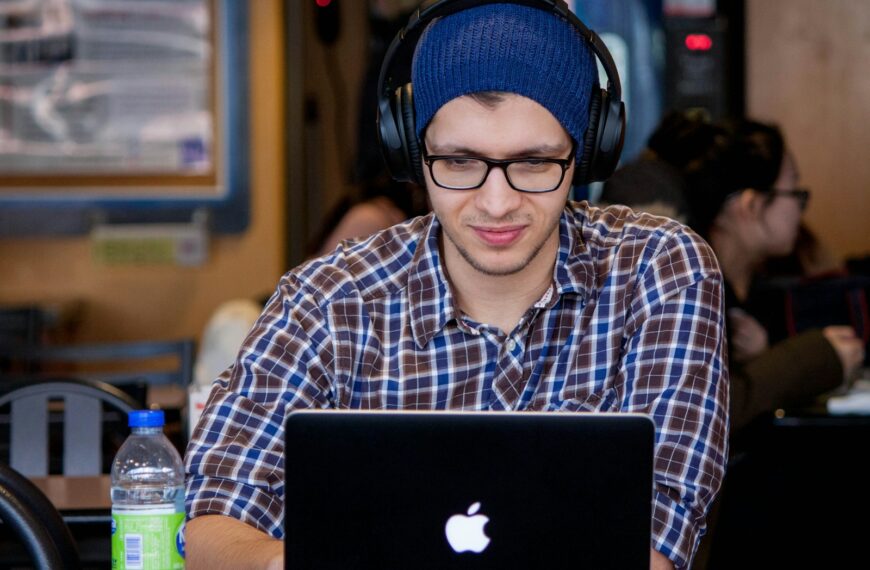 man using MacBook during daytime