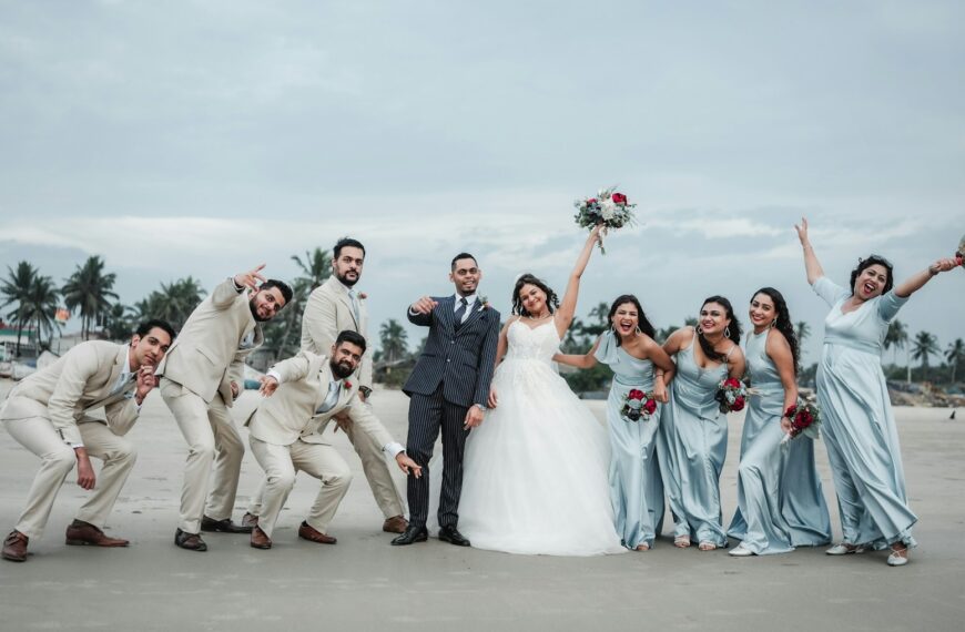 A group of people standing next to each other on a beach
