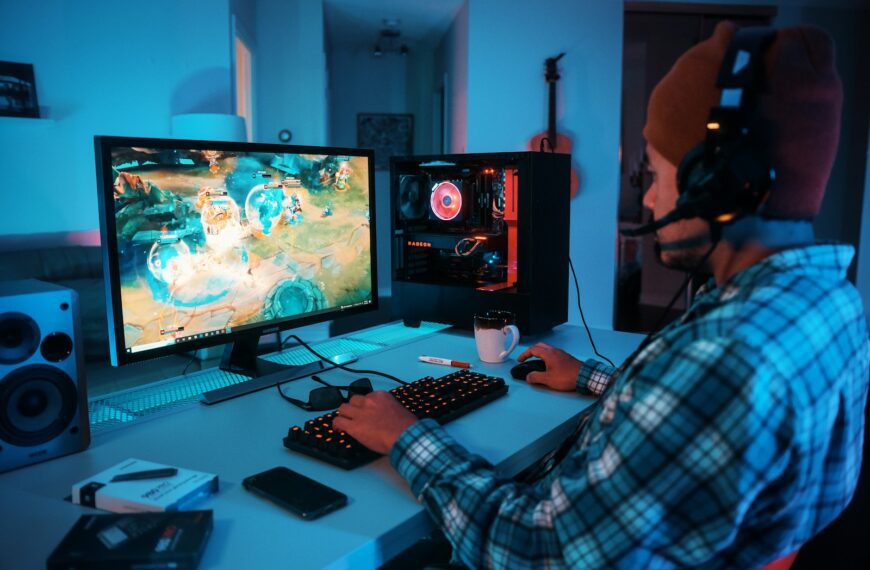 a person wearing headphones and using a computer