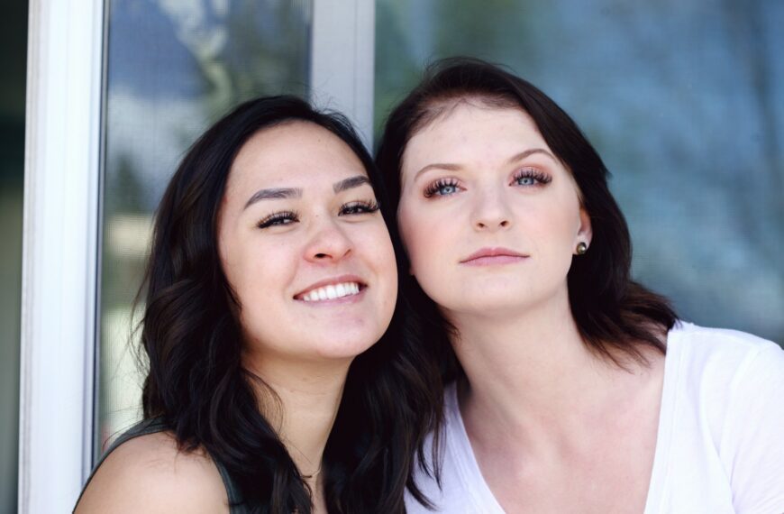 woman in white tank top beside woman in white tank top