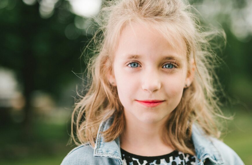 smiling girl in blue denim jacket