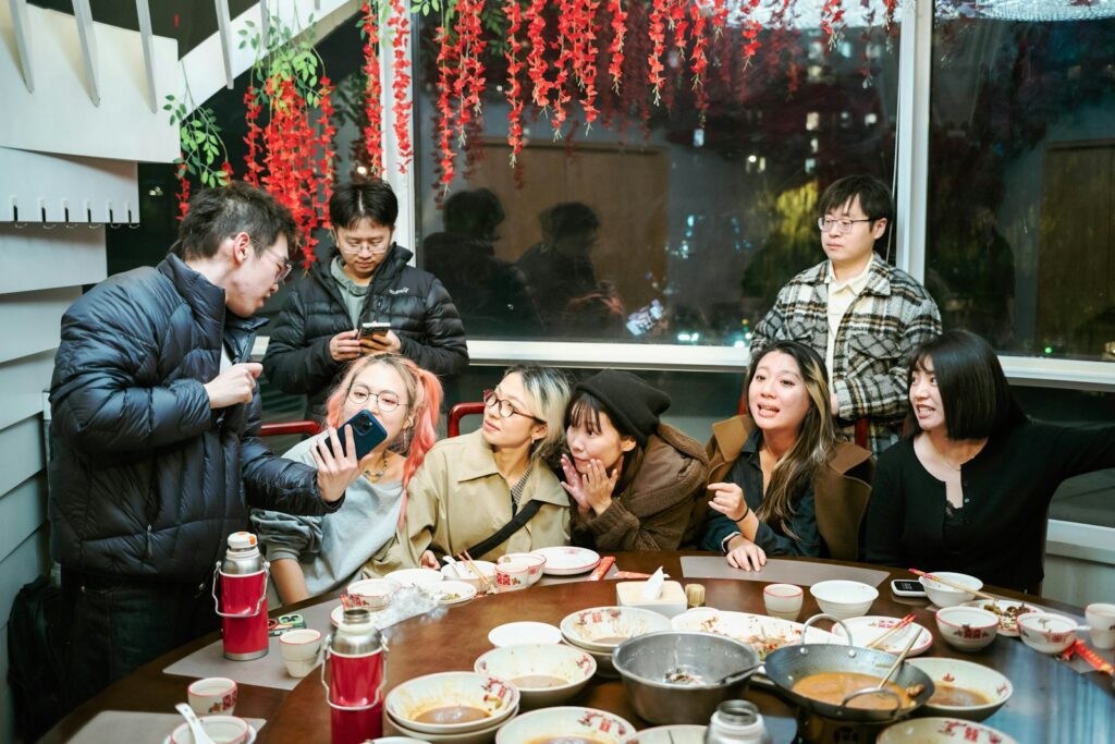 Group of friends gathered around a table for a meal.