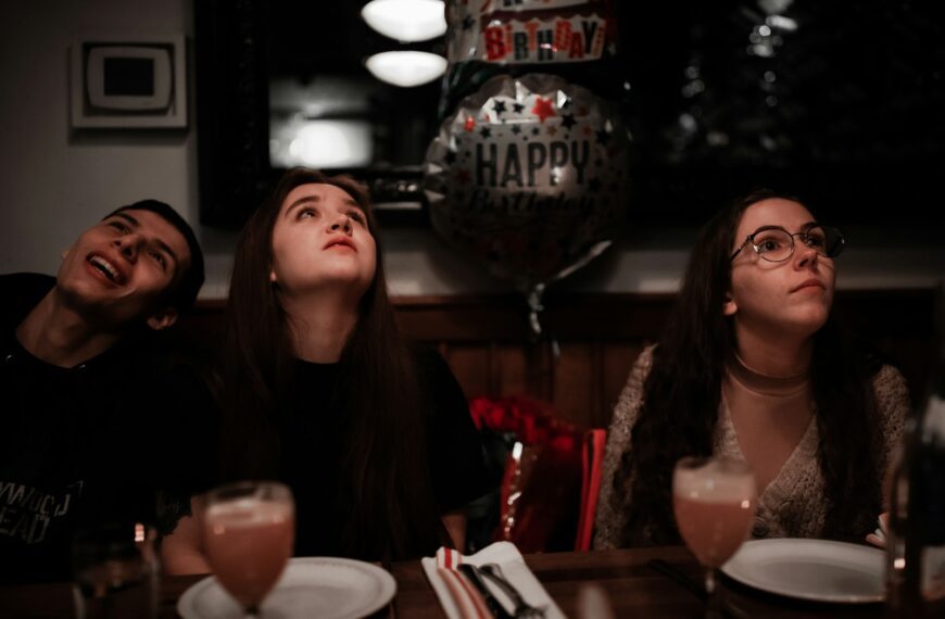 a group of people sitting at a table with drinks