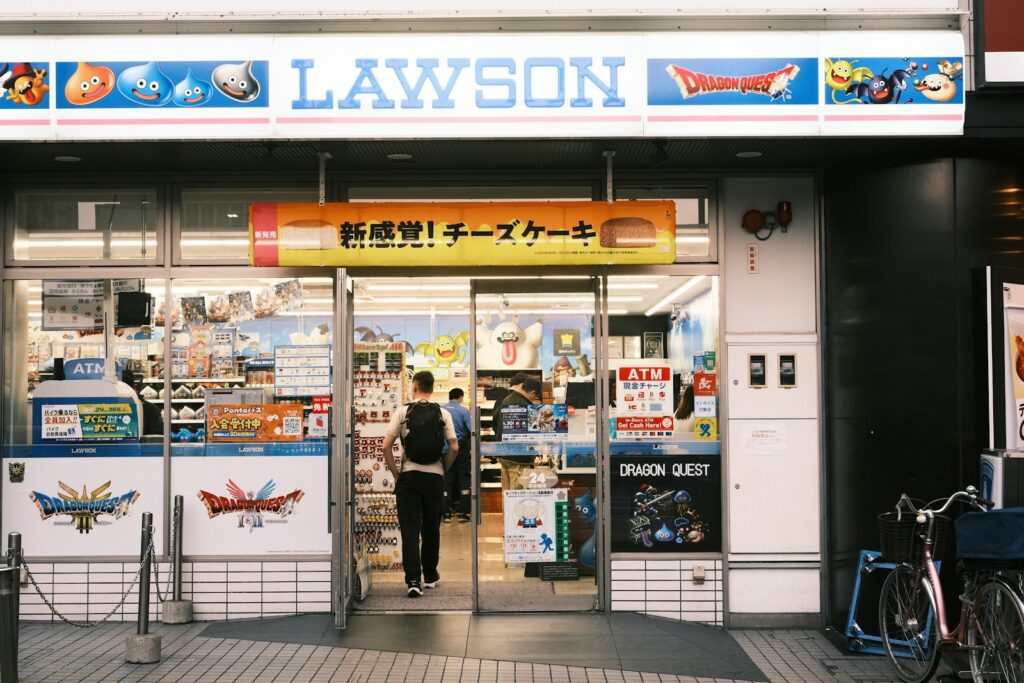 A person enters a lawson convenience store in japan.